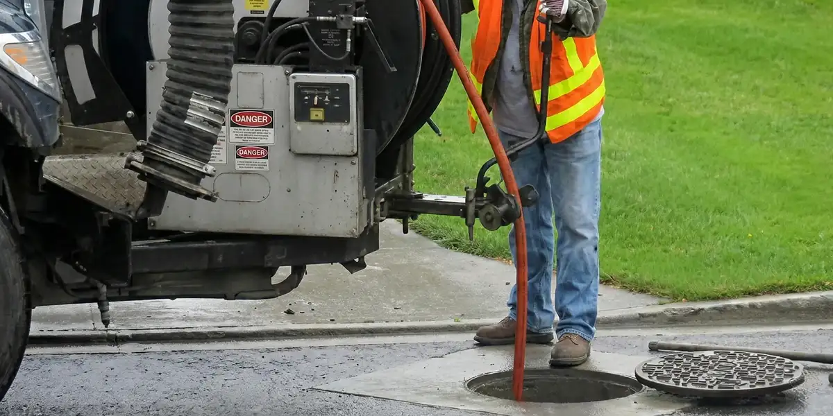 sewage clean up professionals using industrial equipment to remove contaminated wastewater in Oakland, CA
