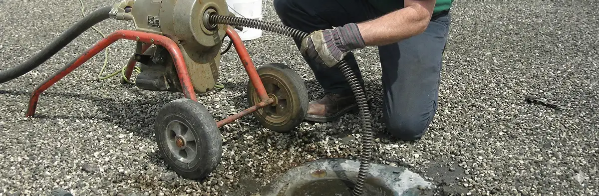 sewer rodding technician actively removing blockages from a sewer line in Oakland, CA
